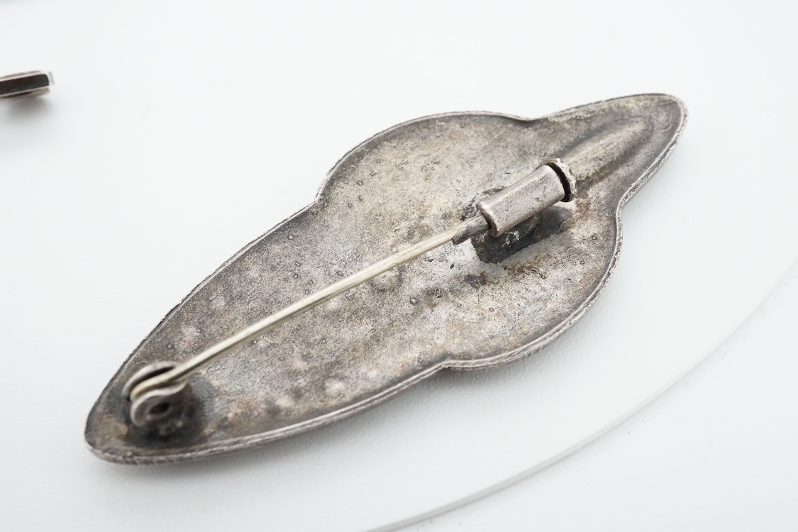 A 1960's Danish silver foliate brooch, by Nils Erik From, import marks possibly for Henry James Hulbert, London, 1964, 37mm, together with a moss agate set white metal bar brooch and a two colour enamel and paste set met